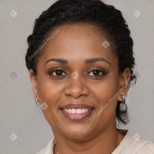 Joyful black adult female with short  brown hair and brown eyes