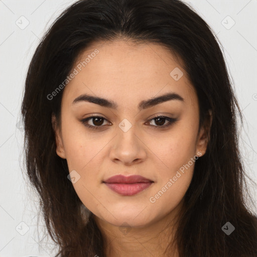 Joyful latino young-adult female with long  brown hair and brown eyes