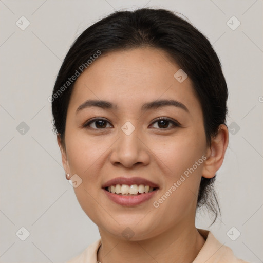 Joyful latino young-adult female with medium  brown hair and brown eyes