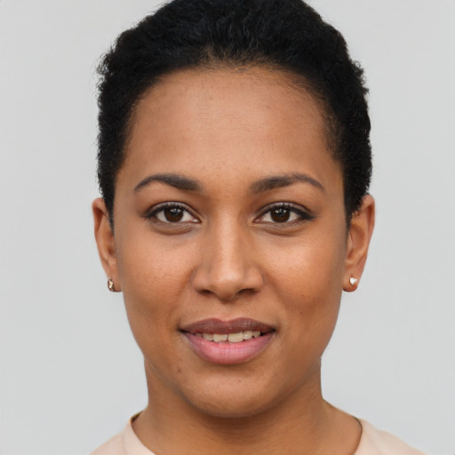 Joyful latino young-adult female with short  black hair and brown eyes