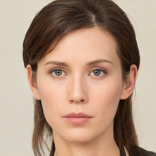 Neutral white young-adult female with long  brown hair and brown eyes