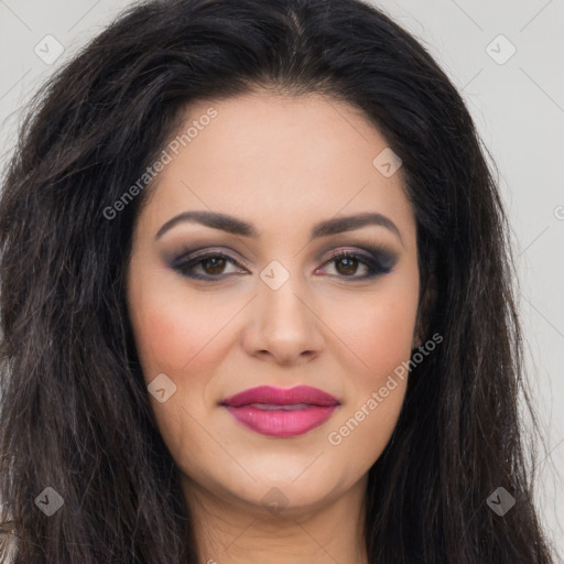 Joyful latino young-adult female with long  brown hair and brown eyes