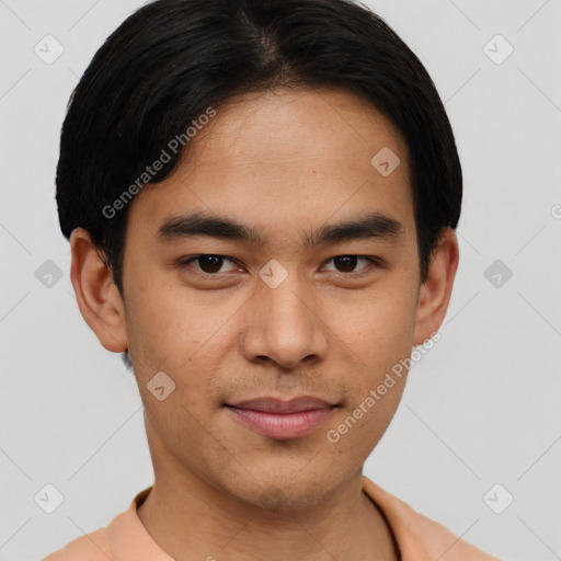 Joyful asian young-adult male with short  brown hair and brown eyes