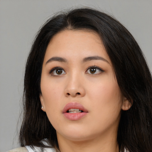 Neutral asian young-adult female with medium  brown hair and brown eyes