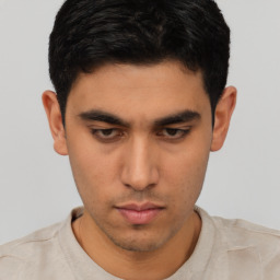 Neutral asian young-adult male with short  brown hair and brown eyes