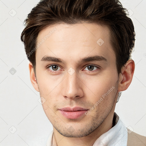 Neutral white young-adult male with short  brown hair and brown eyes