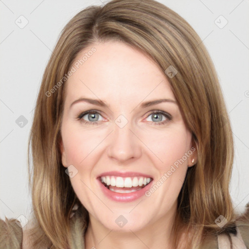 Joyful white young-adult female with medium  brown hair and green eyes