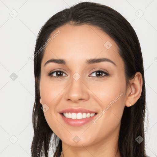 Joyful white young-adult female with long  black hair and brown eyes