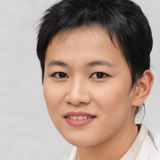 Joyful asian young-adult female with medium  brown hair and brown eyes
