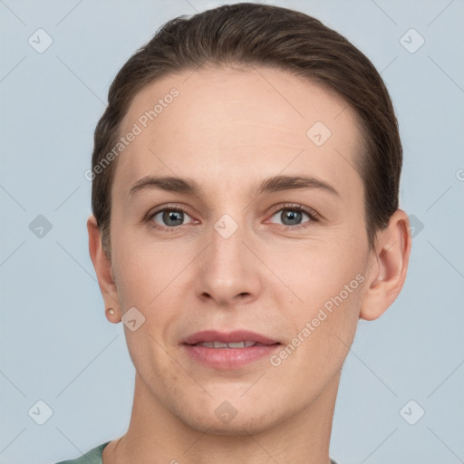 Joyful white young-adult female with short  brown hair and grey eyes