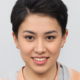 Joyful asian young-adult female with short  brown hair and brown eyes