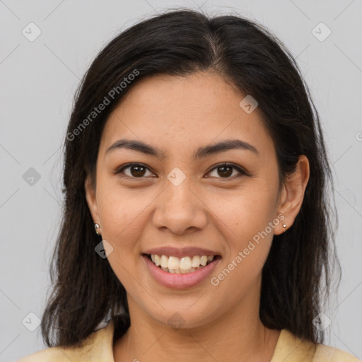 Joyful latino young-adult female with medium  brown hair and brown eyes