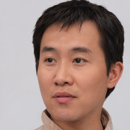 Neutral asian young-adult male with short  brown hair and brown eyes
