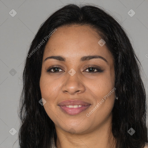 Joyful black young-adult female with long  brown hair and brown eyes