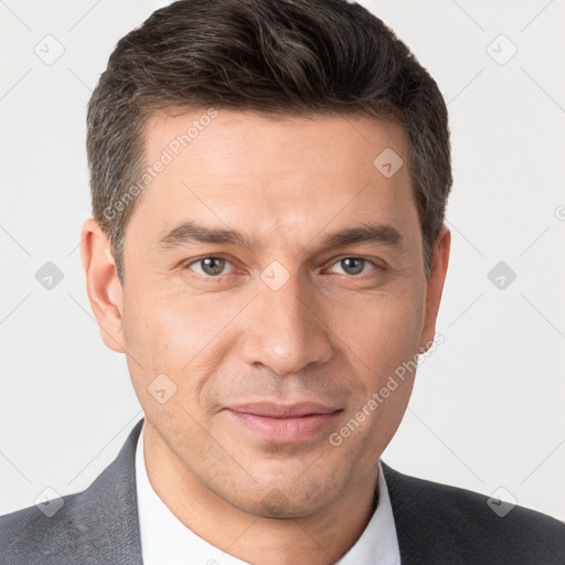 Joyful white adult male with short  brown hair and brown eyes