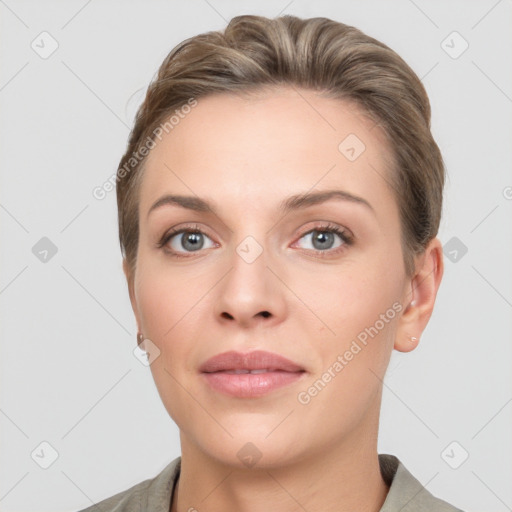 Joyful white young-adult female with short  brown hair and grey eyes