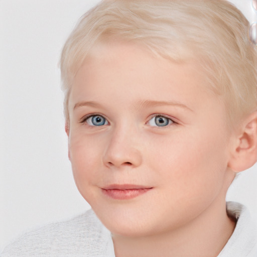 Joyful white child female with short  brown hair and blue eyes