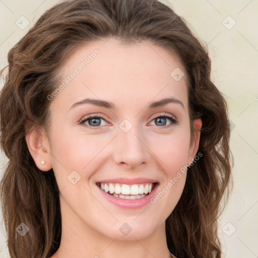 Joyful white young-adult female with long  brown hair and green eyes