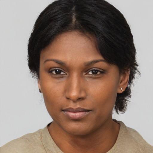 Neutral black young-adult female with short  black hair and brown eyes