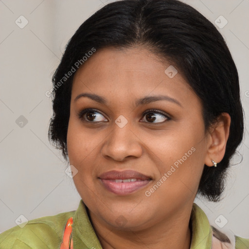 Joyful black adult female with medium  brown hair and brown eyes