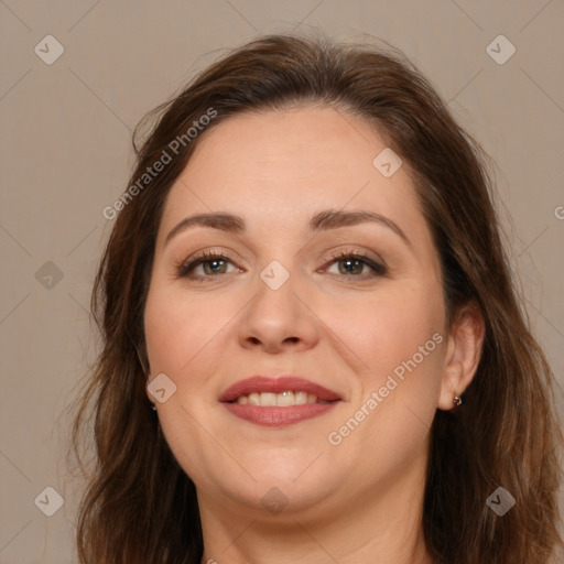 Joyful white adult female with long  brown hair and brown eyes