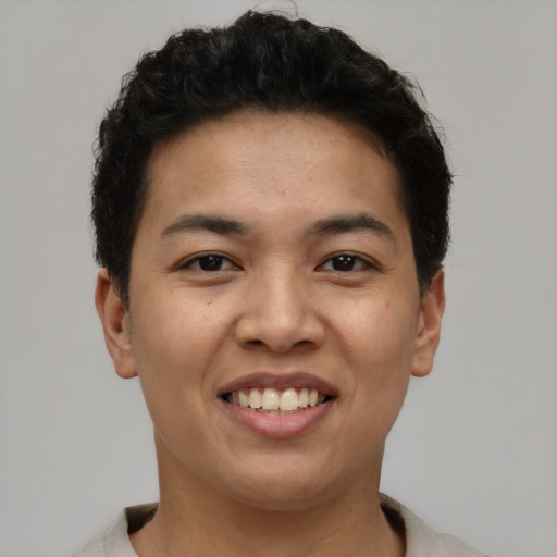 Joyful asian young-adult female with short  brown hair and brown eyes