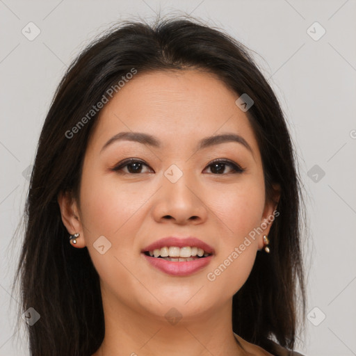 Joyful asian young-adult female with long  brown hair and brown eyes