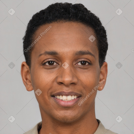 Joyful black young-adult male with short  black hair and brown eyes
