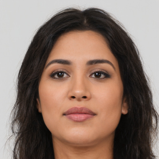 Neutral latino young-adult female with long  brown hair and brown eyes