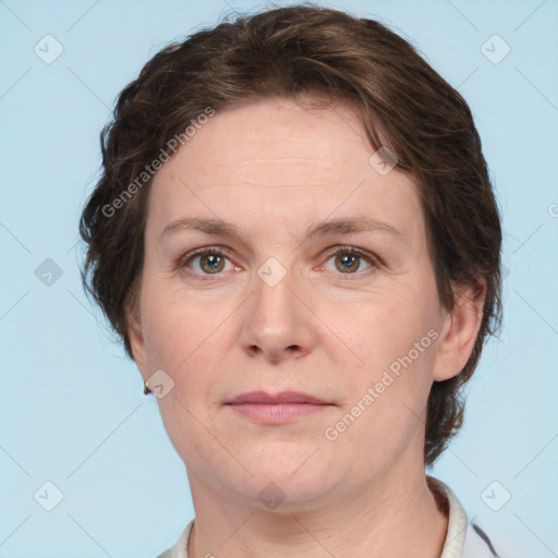 Joyful white adult female with short  brown hair and grey eyes