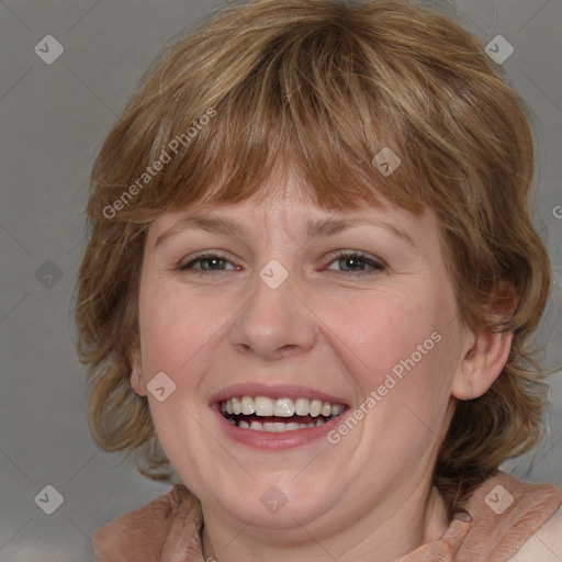 Joyful white adult female with medium  brown hair and blue eyes