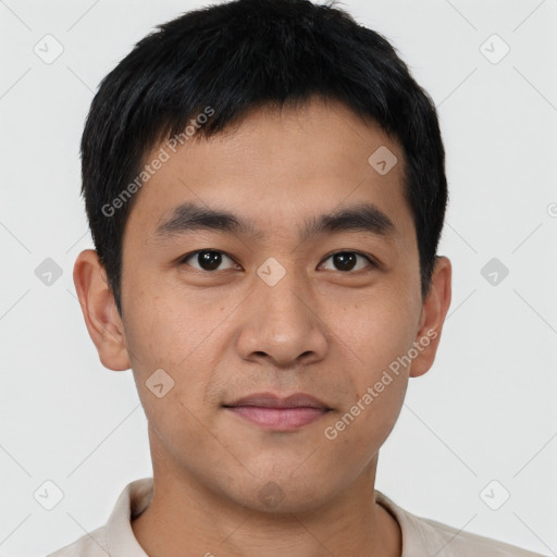 Joyful asian young-adult male with short  black hair and brown eyes