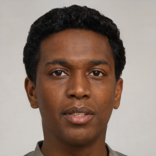 Neutral black young-adult male with short  black hair and brown eyes