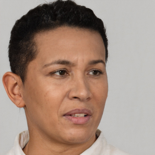 Neutral latino adult male with short  brown hair and brown eyes