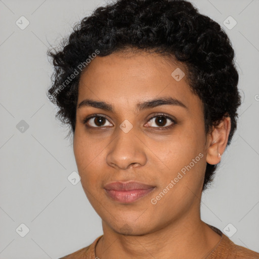 Joyful latino young-adult female with short  black hair and brown eyes