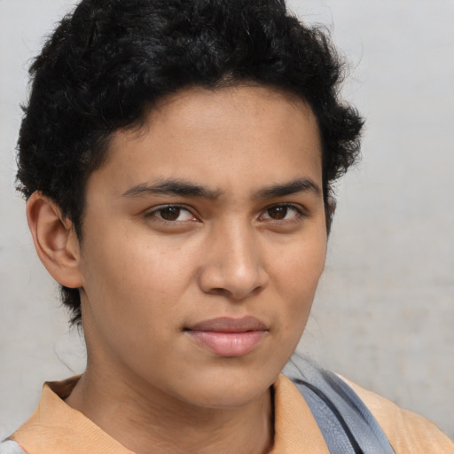 Neutral latino young-adult male with short  brown hair and brown eyes