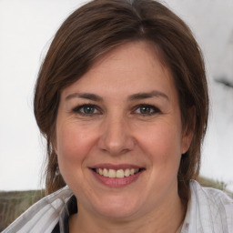 Joyful white young-adult female with medium  brown hair and brown eyes