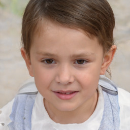 Joyful white child male with short  brown hair and brown eyes