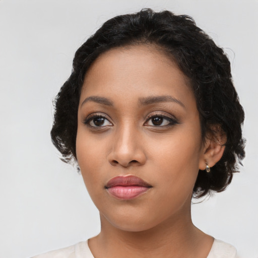 Neutral latino young-adult female with long  black hair and brown eyes