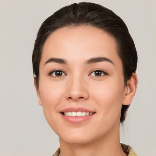 Joyful white young-adult female with medium  brown hair and brown eyes