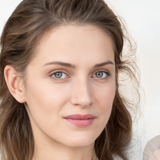 Joyful white young-adult female with medium  brown hair and blue eyes