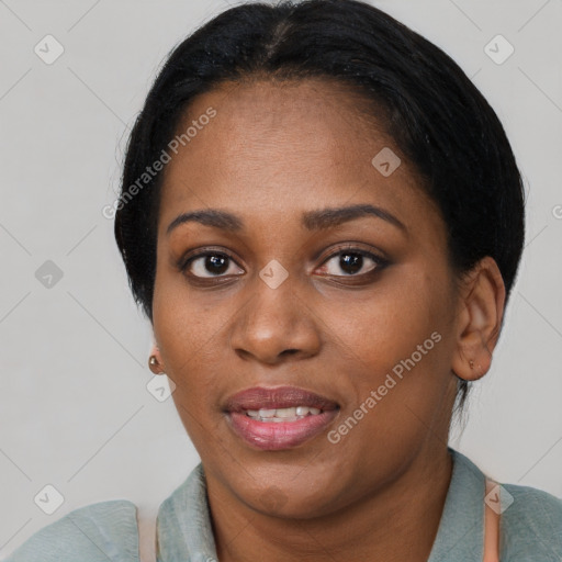 Joyful black young-adult female with short  black hair and brown eyes