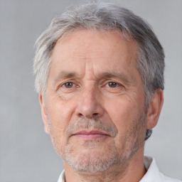 Neutral white middle-aged male with short  gray hair and brown eyes