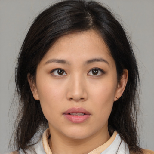 Neutral asian young-adult female with medium  brown hair and brown eyes