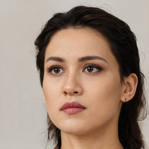 Neutral white young-adult female with long  brown hair and brown eyes