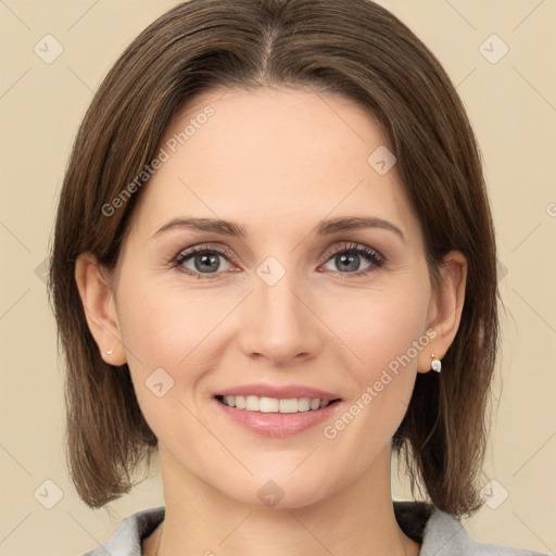 Joyful white young-adult female with medium  brown hair and green eyes