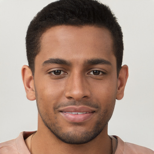 Joyful black young-adult male with short  brown hair and brown eyes