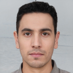 Neutral white young-adult male with short  black hair and brown eyes