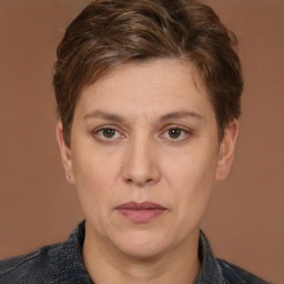 Joyful white adult female with short  brown hair and brown eyes