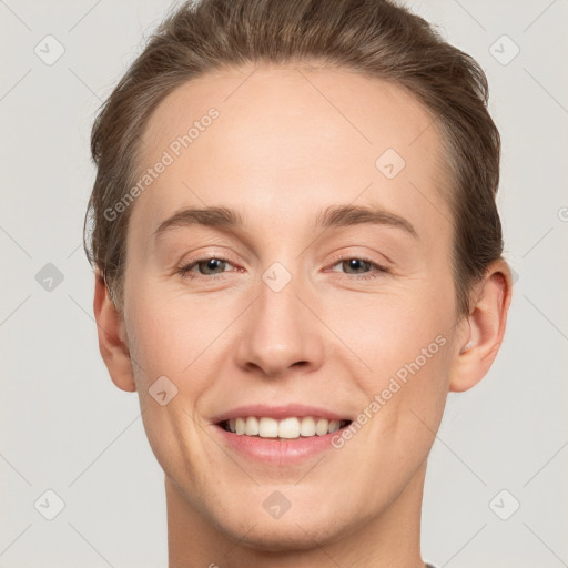 Joyful white young-adult female with short  brown hair and grey eyes